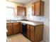 Oak cabinets and tiled floor in this eat-in kitchen at 2010 14Th St, Columbus, IN 47201