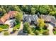 Overhead shot of a brick residence featuring mature trees, a well-manicured lawn, and an inviting front entrance at 3441 S Overlook Pass, New Palestine, IN 46163