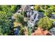 Aerial view of a home with a backyard that has multiple decks overlooking a creek and lush greenery at 3441 S Overlook Pass, New Palestine, IN 46163