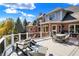 Large backyard deck with lots of seating and space for entertainment at a brick home at 3441 S Overlook Pass, New Palestine, IN 46163