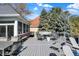 Spacious backyard deck with an outdoor dining area and cozy seating arrangements at 3441 S Overlook Pass, New Palestine, IN 46163