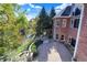 Backyard patio and creek with professional landscaping and trees visible from a brick home at 3441 S Overlook Pass, New Palestine, IN 46163