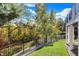 Beautiful backyard view with a creek, lush greenery, and a well-manicured lawn at 3441 S Overlook Pass, New Palestine, IN 46163