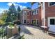 Expansive brick home exterior featuring a paved patio, manicured landscaping, and elegant architectural details at 3441 S Overlook Pass, New Palestine, IN 46163