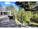 Scenic backyard featuring a patio, mature trees, and a serene creek, creating a peaceful outdoor retreat at 3441 S Overlook Pass, New Palestine, IN 46163