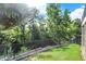 Picturesque backyard featuring a well-manicured lawn and mature trees near a creek at 3441 S Overlook Pass, New Palestine, IN 46163