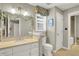 Bright bathroom with white vanity, beige countertop, and decorative window valance at 3441 S Overlook Pass, New Palestine, IN 46163