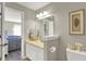 Bathroom featuring a white vanity with a beige countertop and an adjacent view into the living room at 3441 S Overlook Pass, New Palestine, IN 46163