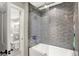 Modern bathroom featuring a gray tiled shower-over-tub with glass enclosure at 3441 S Overlook Pass, New Palestine, IN 46163