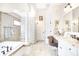 Bright bathroom with double sinks, granite counters, and glass block shower surround at 3441 S Overlook Pass, New Palestine, IN 46163
