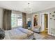 Well-lit bedroom with chandelier, walk-in closet, and en-suite bathroom at 3441 S Overlook Pass, New Palestine, IN 46163