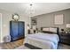 Stylish bedroom features chandelier, sleek furniture, and a serene ambiance at 3441 S Overlook Pass, New Palestine, IN 46163