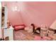Unique bedroom featuring pink walls, plush seating, and playful decor at 3441 S Overlook Pass, New Palestine, IN 46163