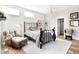 Bright bedroom featuring a cozy chair, elegant bed frame, and an abundance of natural light at 3441 S Overlook Pass, New Palestine, IN 46163