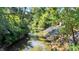 Scenic creek view with lush greenery and natural rock formations along the banks at 3441 S Overlook Pass, New Palestine, IN 46163