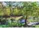Scenic creek view with vibrant foliage and lush greenery creating a tranquil setting at 3441 S Overlook Pass, New Palestine, IN 46163