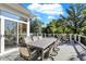 Expansive deck perfect for entertaining with dining and seating areas and large sliding glass door at 3441 S Overlook Pass, New Palestine, IN 46163