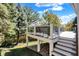 Elevated deck with white railing, offering peaceful views of the well-maintained backyard at 3441 S Overlook Pass, New Palestine, IN 46163