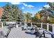 Wide deck with a fire pit and lots of outdoor seating for entertaining friends and Gathering at 3441 S Overlook Pass, New Palestine, IN 46163