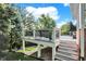 Relaxing deck area perfect for outdoor dining and lounging with wooded backyard views at 3441 S Overlook Pass, New Palestine, IN 46163