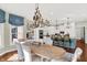 Open concept dining area and kitchen with hardwood floors and bright light at 3441 S Overlook Pass, New Palestine, IN 46163