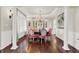 Formal dining room with hardwood floors, elegant lighting, and wainscoting at 3441 S Overlook Pass, New Palestine, IN 46163