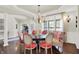 Open dining room featuring modern lighting, wainscoting, and views into the living room at 3441 S Overlook Pass, New Palestine, IN 46163