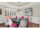Bright dining room featuring modern lighting, wainscoting, and built-in china cabinet at 3441 S Overlook Pass, New Palestine, IN 46163