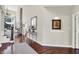 Elegant foyer with hardwood floors, a decorative mirror, and access to the staircase and other rooms at 3441 S Overlook Pass, New Palestine, IN 46163