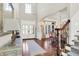 Impressive foyer with hardwood floors and staircase, highlighting the home's grand entrance at 3441 S Overlook Pass, New Palestine, IN 46163