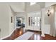 Grand foyer with hardwood floors and a view into an office, showcasing the home's elegance at 3441 S Overlook Pass, New Palestine, IN 46163