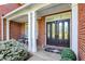 Inviting front entrance with double doors and white columns, surrounded by manicured greenery at 3441 S Overlook Pass, New Palestine, IN 46163