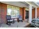 Relaxing front porch with rocking chairs and a view of the landscaped front yard at 3441 S Overlook Pass, New Palestine, IN 46163