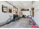 Well organized garage with shelving, overhead lighting, and extra wall storage solutions at 3441 S Overlook Pass, New Palestine, IN 46163
