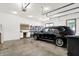 Spacious two car garage featuring built in storage, a work bench, and bright lighting at 3441 S Overlook Pass, New Palestine, IN 46163