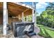 Inviting hot tub situated beneath a spacious deck, perfect for relaxation at 3441 S Overlook Pass, New Palestine, IN 46163