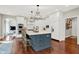Modern kitchen featuring white cabinets, stainless steel appliances, and a center island with bar stools at 3441 S Overlook Pass, New Palestine, IN 46163
