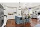 Bright kitchen featuring white cabinets, stainless steel appliances, and a center island with bar seating at 3441 S Overlook Pass, New Palestine, IN 46163