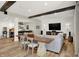 Basement living room and dining area features a bar, modern TV, white shiplap and wood beams at 3441 S Overlook Pass, New Palestine, IN 46163