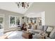 Spacious living room with hardwood floors, neutral tones, and an open layout to the dining area at 3441 S Overlook Pass, New Palestine, IN 46163