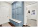 Mudroom featuring built-in storage cabinets, bench seating, and a view of the hallway at 3441 S Overlook Pass, New Palestine, IN 46163