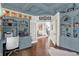 Inviting home office featuring custom blue built-ins, hardwood floors, and french doors at 3441 S Overlook Pass, New Palestine, IN 46163