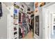 Spacious walk-in closet with custom shelving, drawers, and hanging racks at 3441 S Overlook Pass, New Palestine, IN 46163