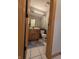 This bathroom features a stylish mirror with great lighting and a vanity with a wood finish at 8429 Admirals Cv, Indianapolis, IN 46236
