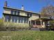 View of the home's exterior featuring a sunroom with many windows, a deck, and a pergola at 8429 Admirals Cv, Indianapolis, IN 46236