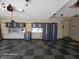 Organized garage with gray and black checkerboard floor and storage system at 8429 Admirals Cv, Indianapolis, IN 46236