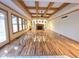 Bright living room featuring hardwood floors, fireplace, and coffered ceiling at 8429 Admirals Cv, Indianapolis, IN 46236