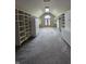 Spacious walk-in closet with custom shelving, drawers and a window at 8429 Admirals Cv, Indianapolis, IN 46236