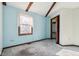 Bedroom with light blue walls, wood beams, carpeting, and closet at 9706 N Glen Dr, Mooresville, IN 46158