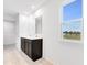 A bathroom showcasing a double sink vanity with modern fixtures and a mirror at 1082 Stubble Run, Danville, IN 46122
